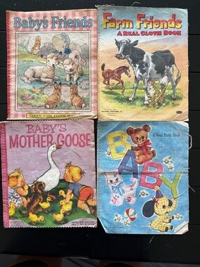 VINTAGE CHILDREN’S CLOTH BOOKS. LOT OF 4